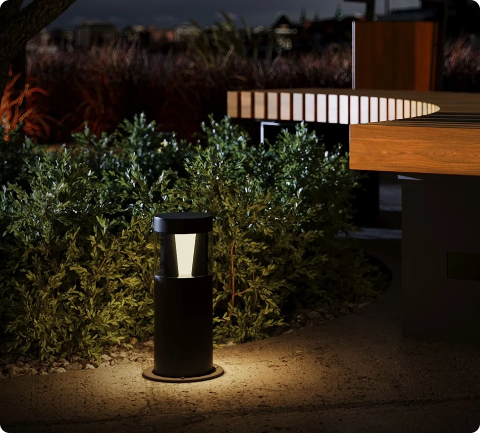 Illuminated bollard lighting a garden path
